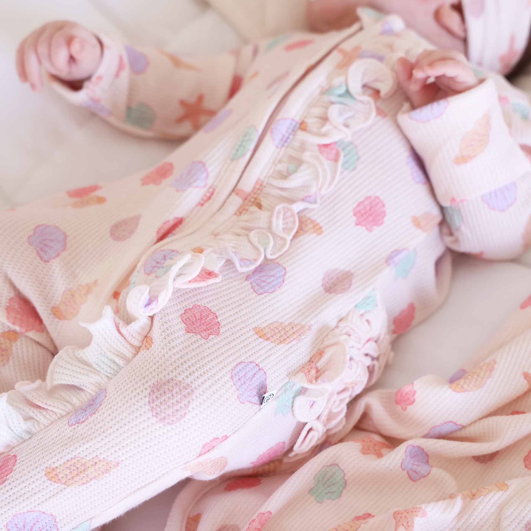 13552-saltwater-shells-bamboo-waffle-zipper-ruffle-footie-1.jpg