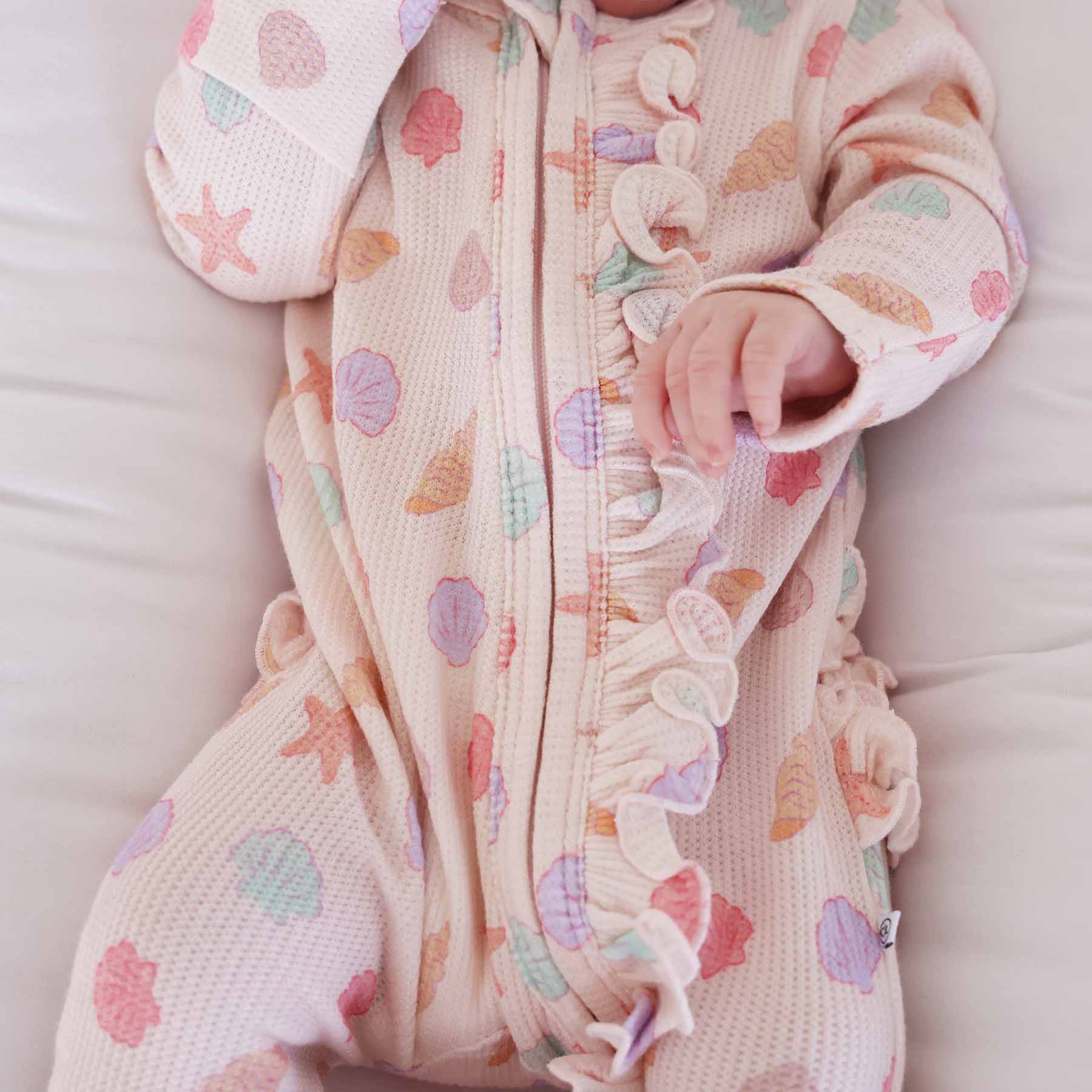 13552-saltwater-shells-bamboo-waffle-zipper-ruffle-footie-1.jpg