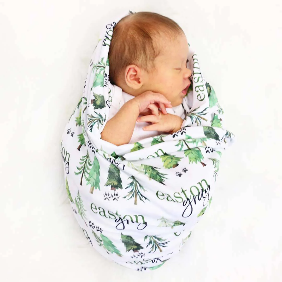 15204-woodland-trees-personalized-baby-name-swaddle-blanket-1.webp