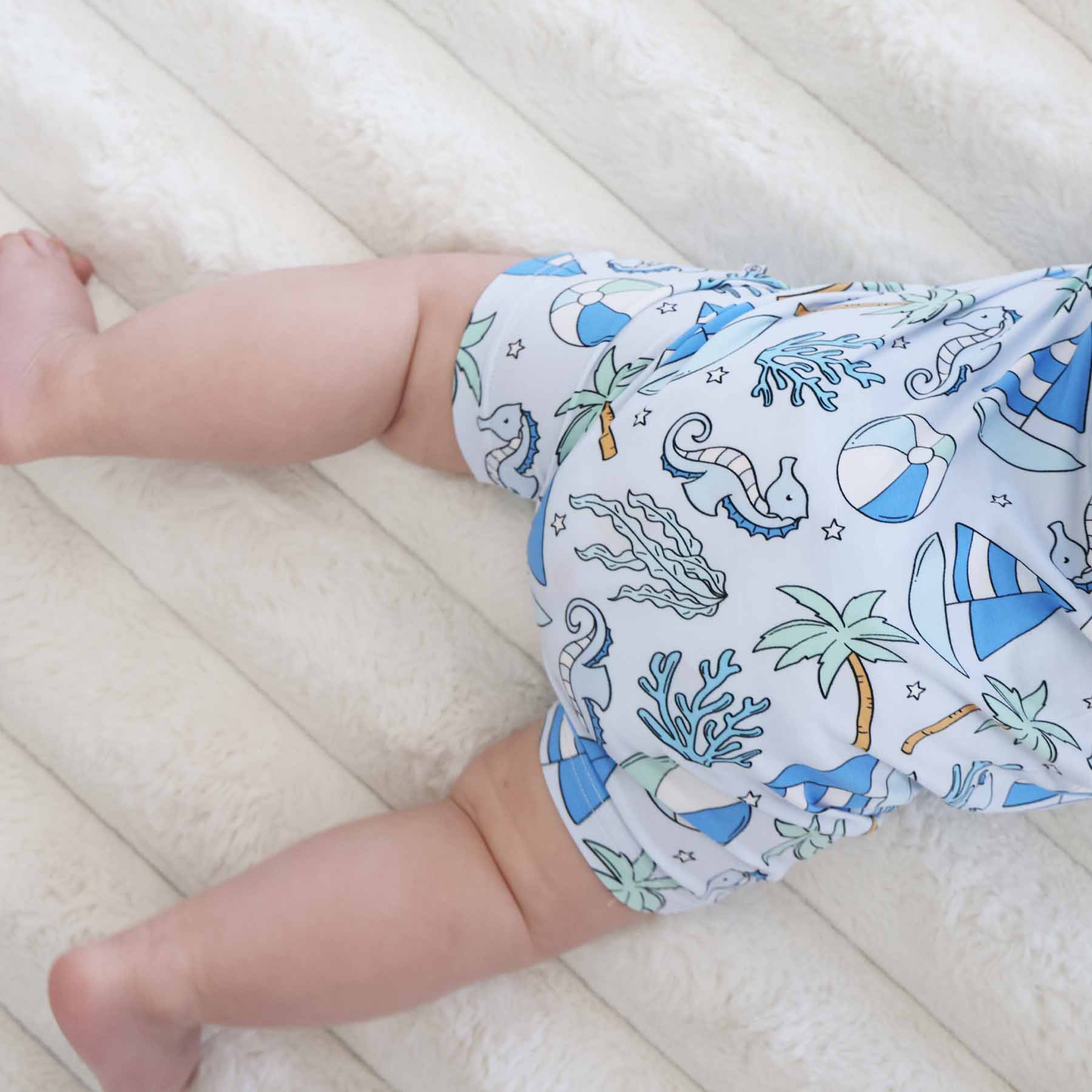 4721-sleeveless-snap-romper-tiny-tides-blue-1.jpg