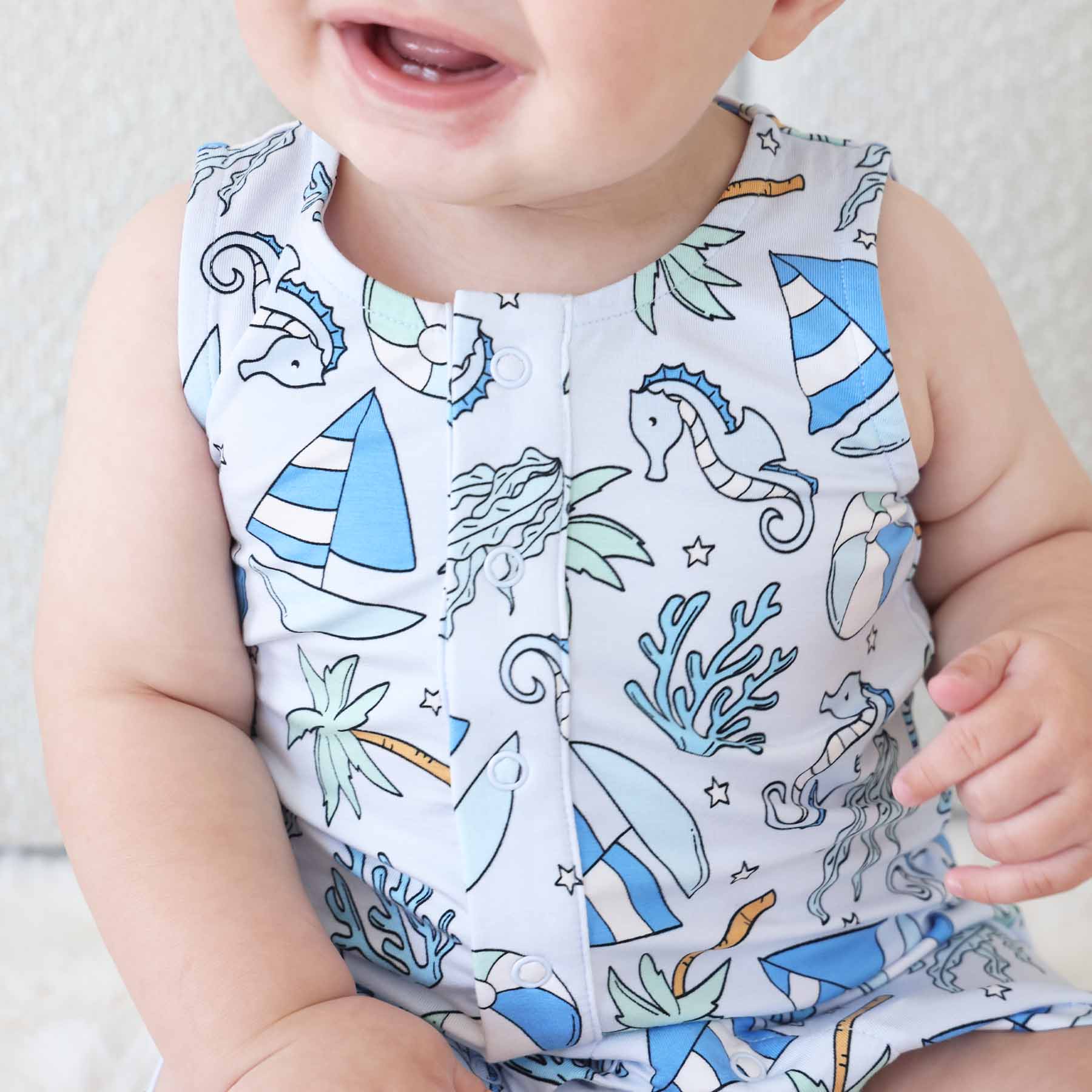 4721-sleeveless-snap-romper-tiny-tides-blue-1.jpg