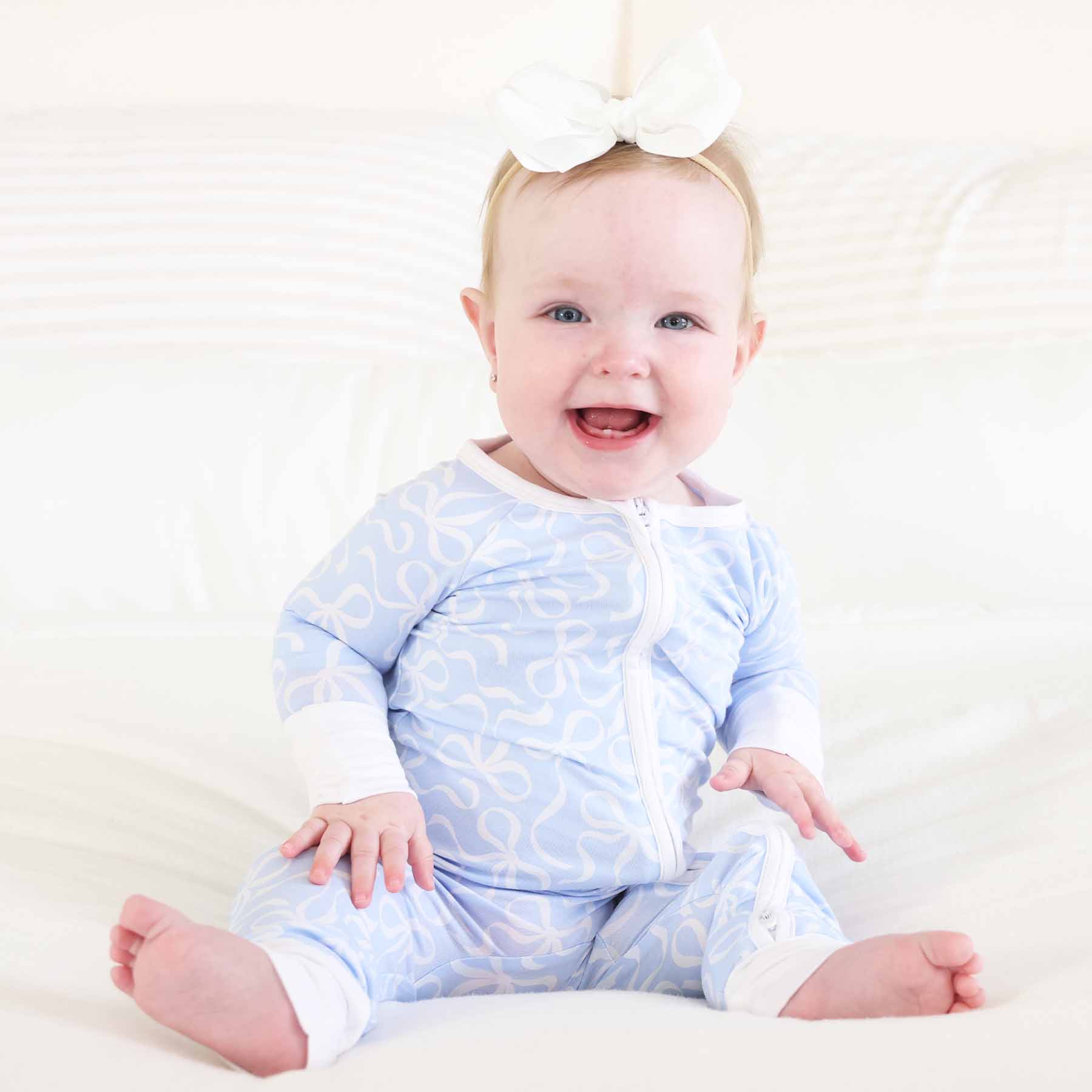 7386-blue-tiful-bows-convertible-zip-romper-1.jpg