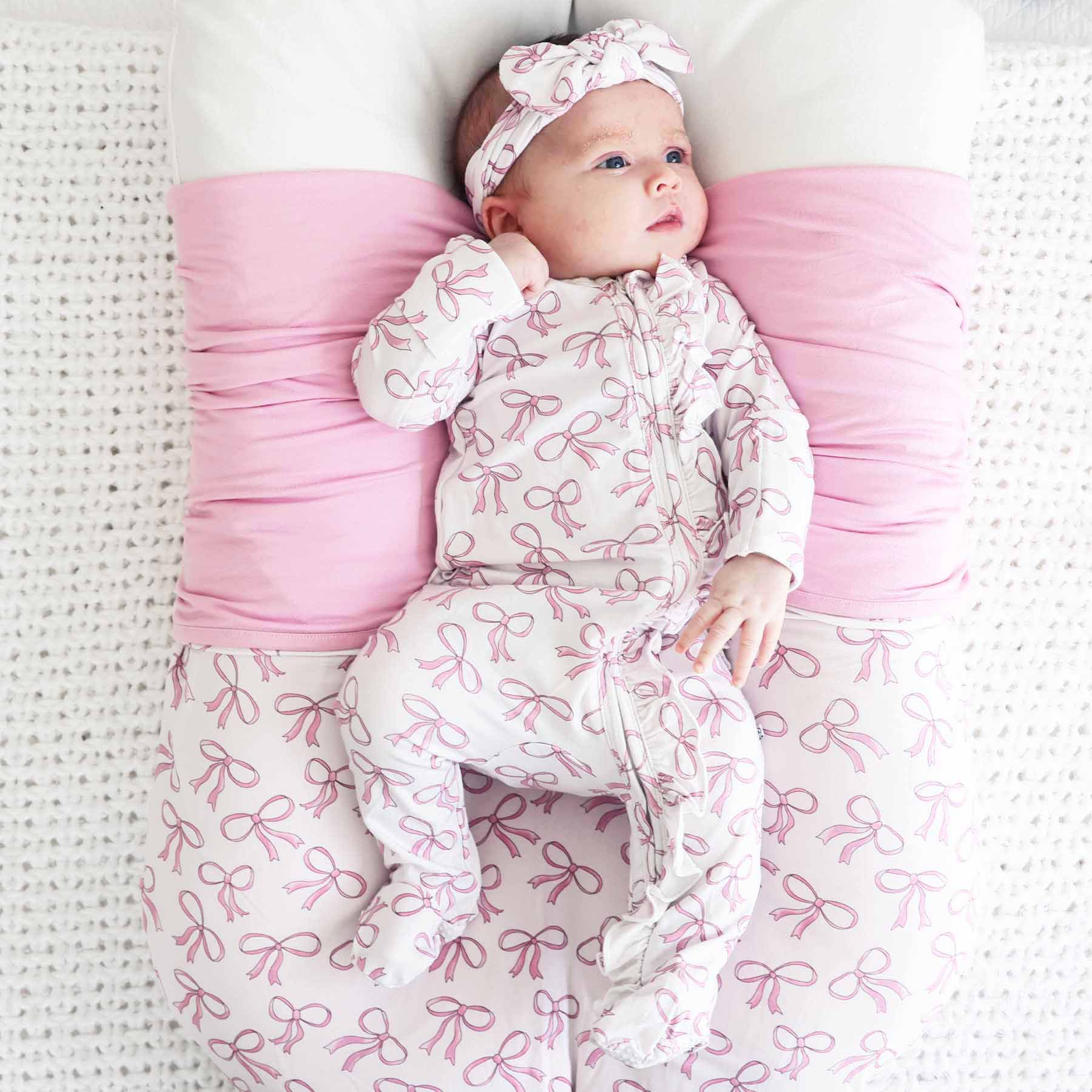 7459-blushing-bows-ruffle-zipper-footie-1.jpg